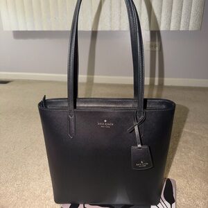 kate spade black leather tote with luggage tag